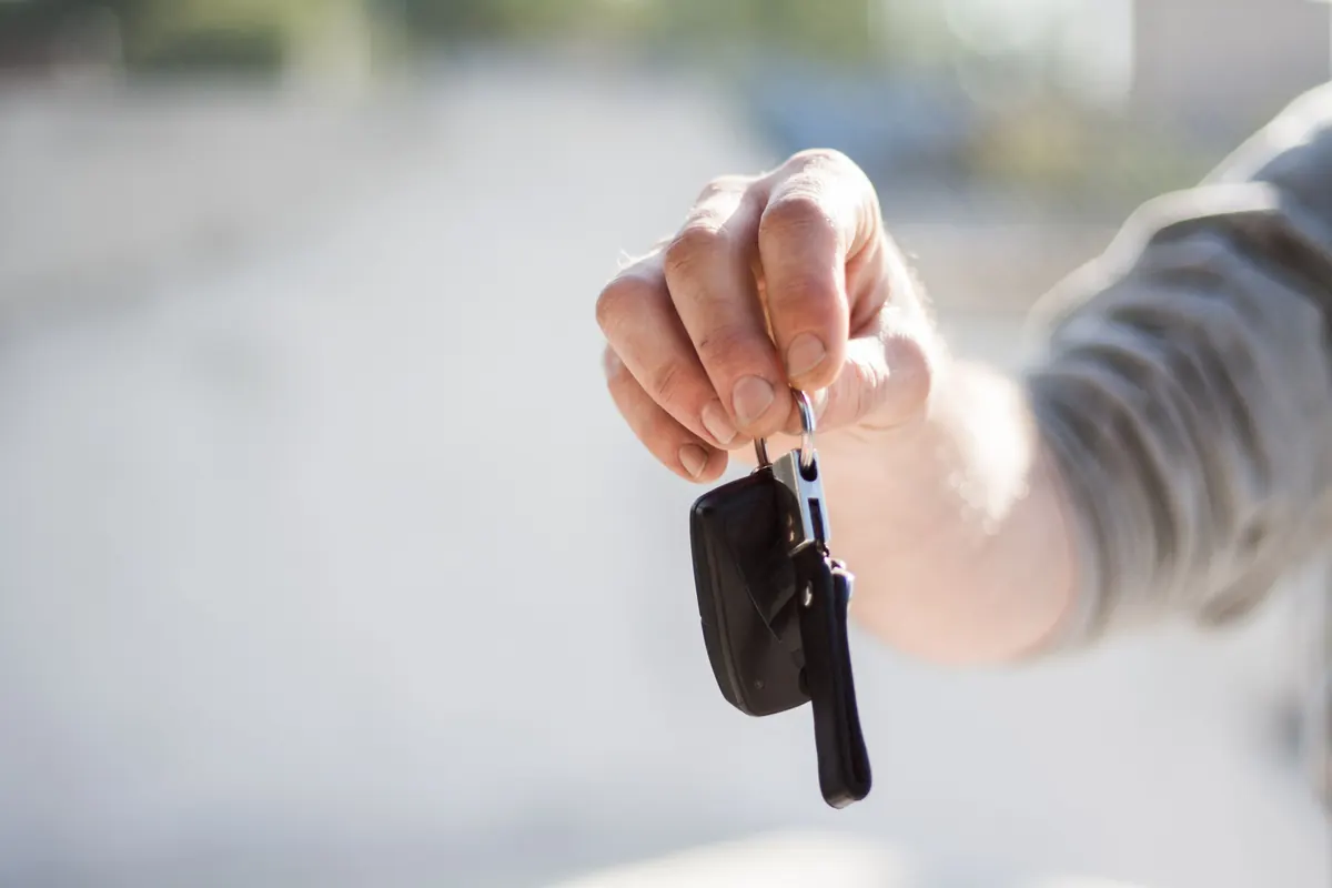 Handing over a rental car key