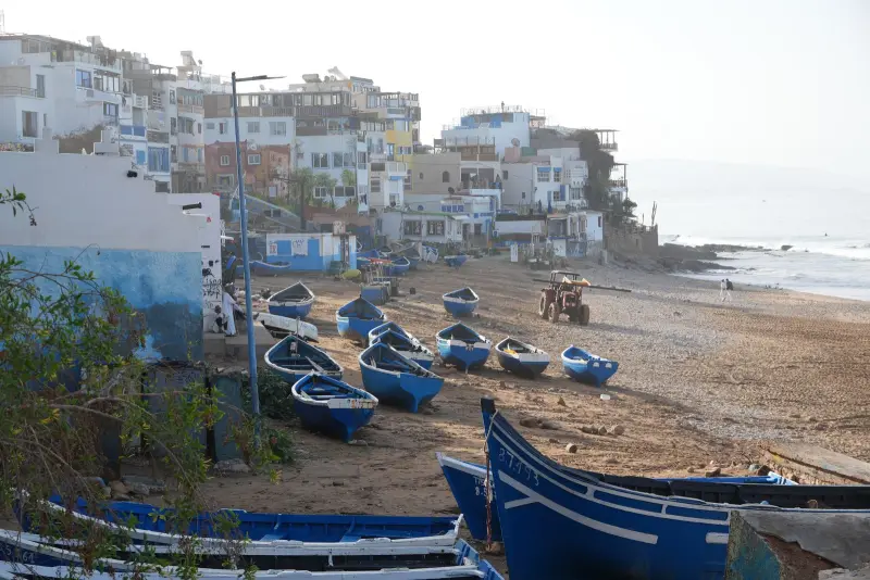 Blue fishing boats on Taghazout beach, north of Agadir